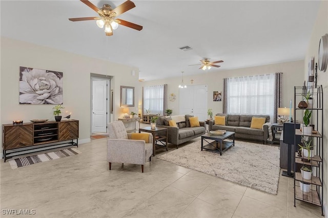 living room featuring ceiling fan and light tile patterned floors