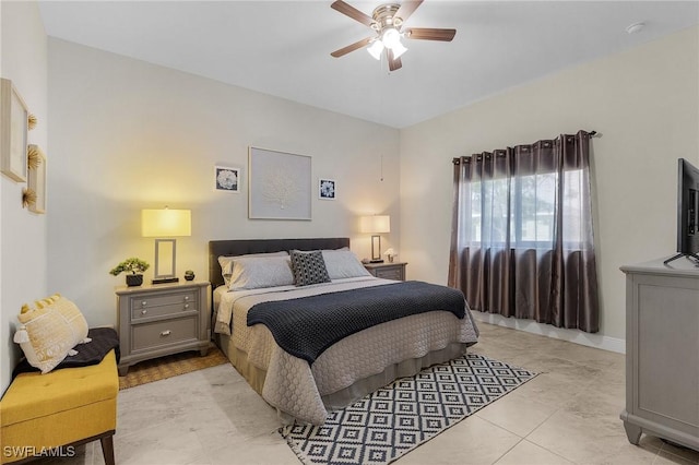 tiled bedroom with ceiling fan