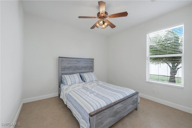 bedroom featuring ceiling fan and light tile patterned flooring