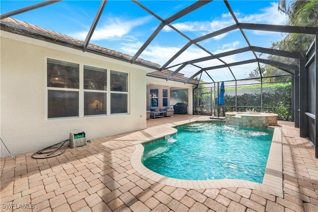 view of swimming pool with pool water feature, a patio, glass enclosure, and an in ground hot tub