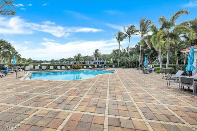 view of swimming pool with a patio