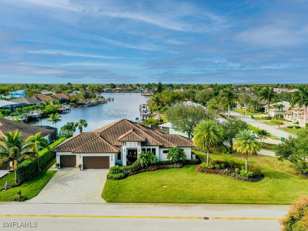 drone / aerial view featuring a water view