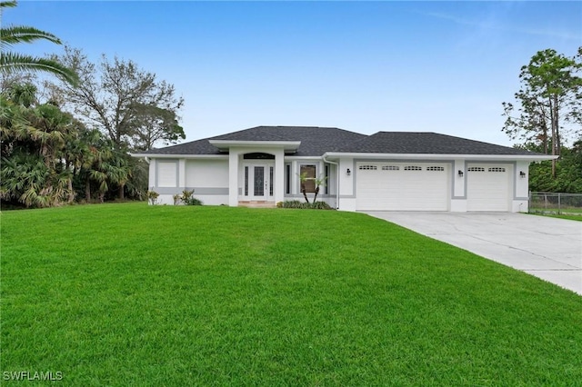 view of front facade featuring a front yard and a garage