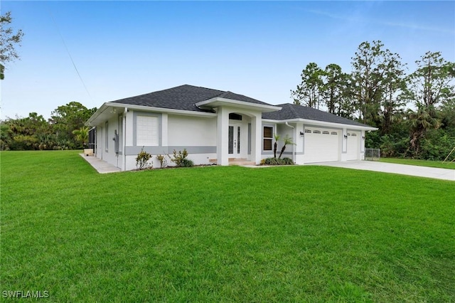 view of front of house featuring a front yard and a garage