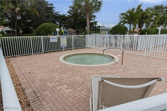 view of pool with a community hot tub