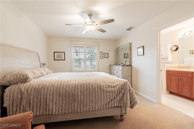 carpeted bedroom featuring ceiling fan, sink, and connected bathroom