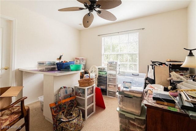 office area featuring ceiling fan and light carpet