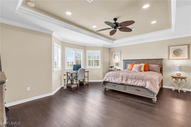 bedroom featuring ceiling fan, dark wood-type flooring, ornamental molding, and a raised ceiling