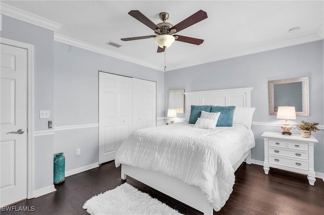 bedroom with ceiling fan, dark hardwood / wood-style flooring, a closet, and ornamental molding