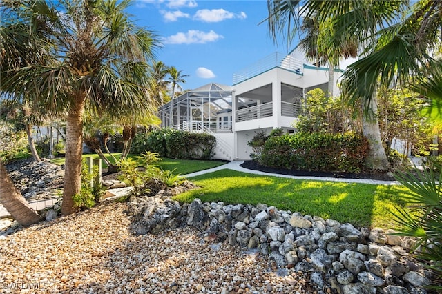 view of yard with a sunroom