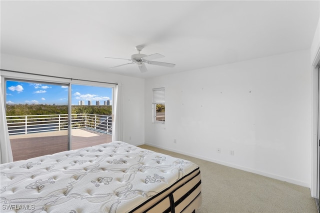 bedroom with ceiling fan, light colored carpet, and access to outside