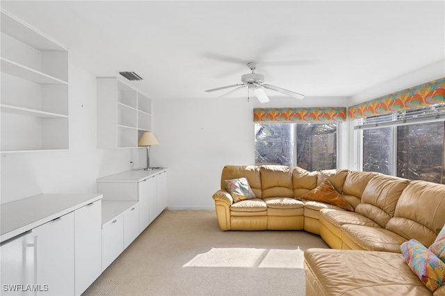 living room featuring ceiling fan and light colored carpet