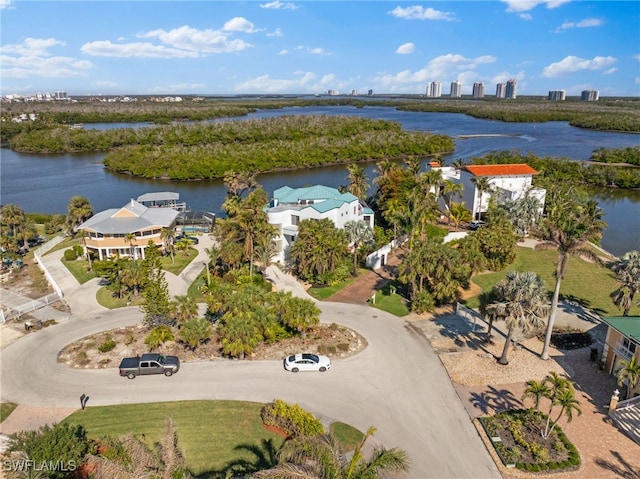 birds eye view of property with a water view