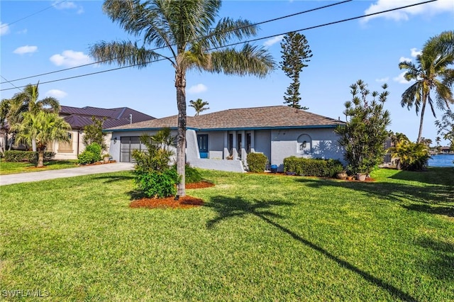 single story home featuring a front lawn and a garage