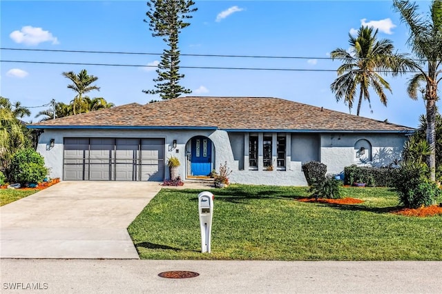 ranch-style home featuring a garage and a front yard