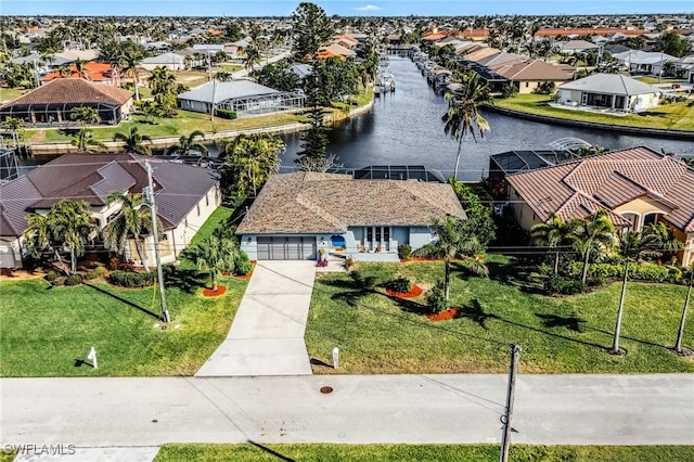 birds eye view of property featuring a water view