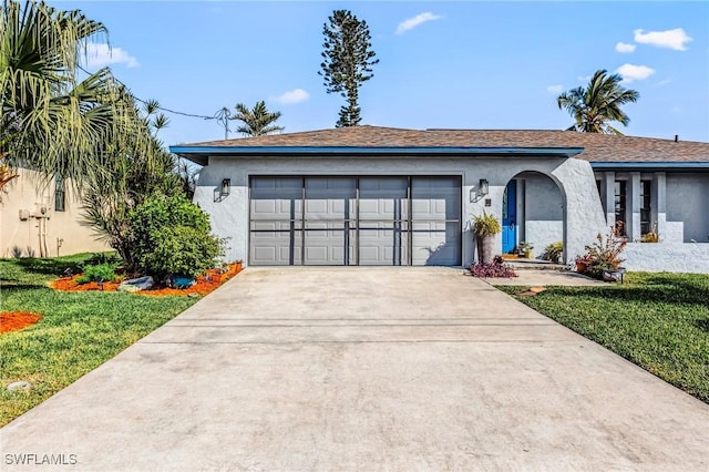 ranch-style home with a garage and a front yard