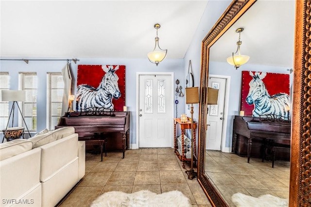 foyer entrance with tile patterned flooring