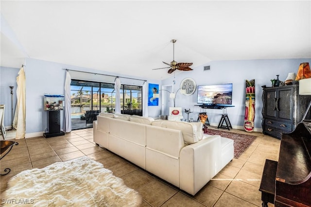 tiled living room with vaulted ceiling and ceiling fan