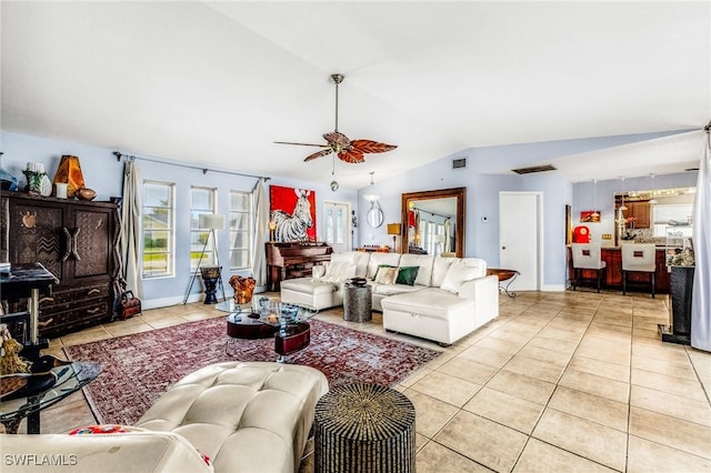 living room with light tile patterned floors, vaulted ceiling, and ceiling fan