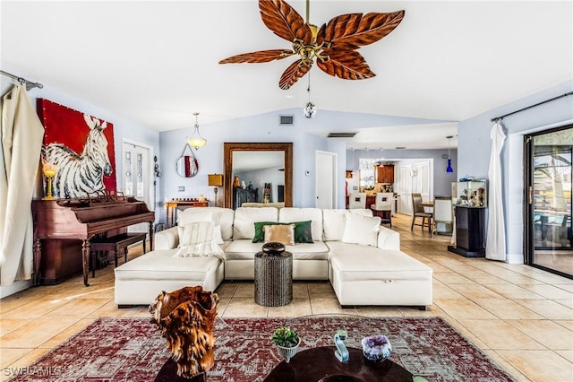 living room with light tile patterned flooring, ceiling fan, and vaulted ceiling