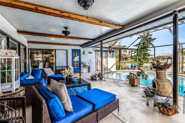 view of patio / terrace with an outdoor living space, a lanai, and ceiling fan