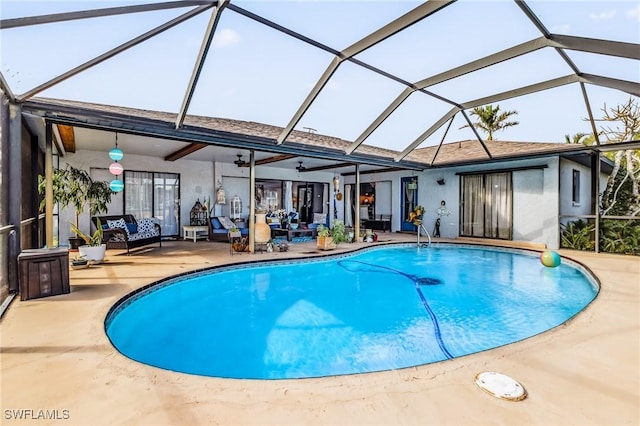 view of swimming pool featuring ceiling fan, an outdoor living space, a lanai, and a patio