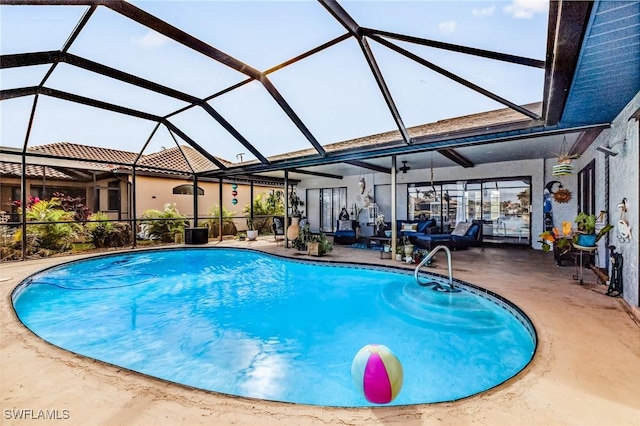 view of swimming pool featuring glass enclosure and a patio area