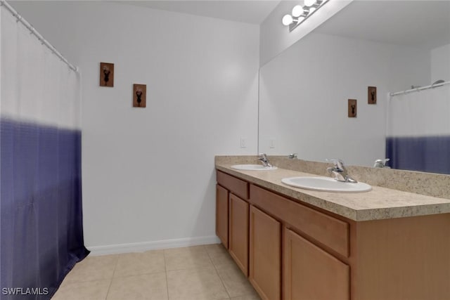 bathroom with tile patterned floors and vanity