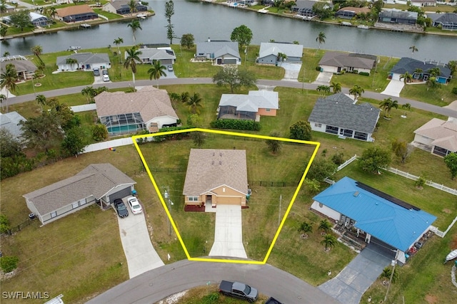 birds eye view of property featuring a water view