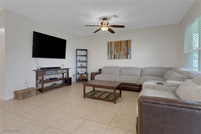 living room with ceiling fan and light tile patterned flooring