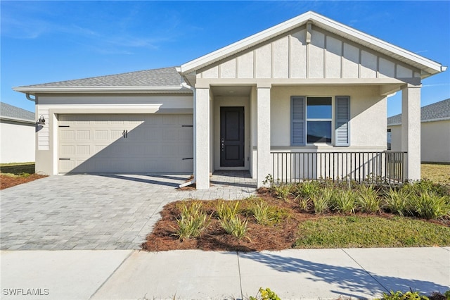 view of front of house with a garage and covered porch