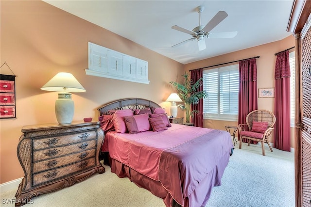 bedroom with ceiling fan and carpet floors