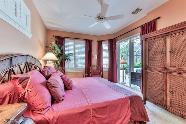 bedroom featuring ceiling fan, access to exterior, light colored carpet, and multiple windows