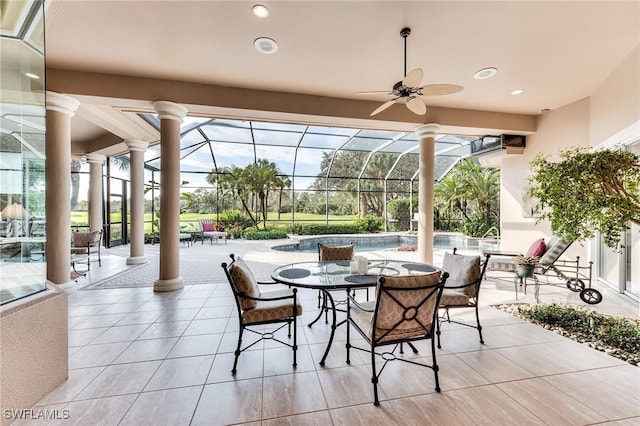 sunroom / solarium featuring ceiling fan