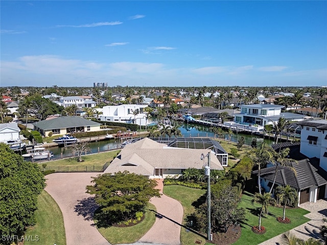 aerial perspective of suburban area with a large body of water
