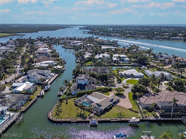 aerial view of residential area with a large body of water