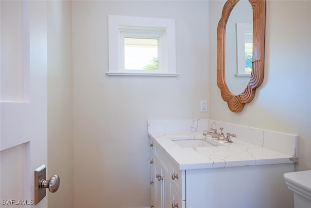 half bath with toilet and vanity