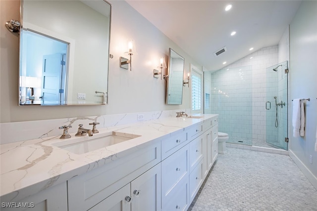 bathroom featuring lofted ceiling, tile patterned flooring, vanity, toilet, and walk in shower