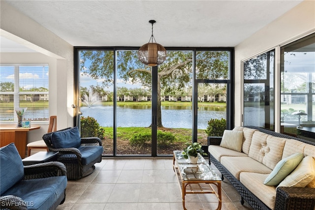 sunroom / solarium with a water view