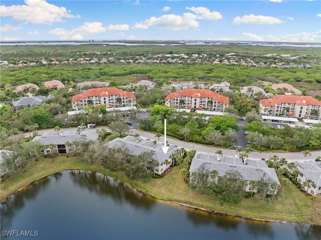 birds eye view of property with a water view