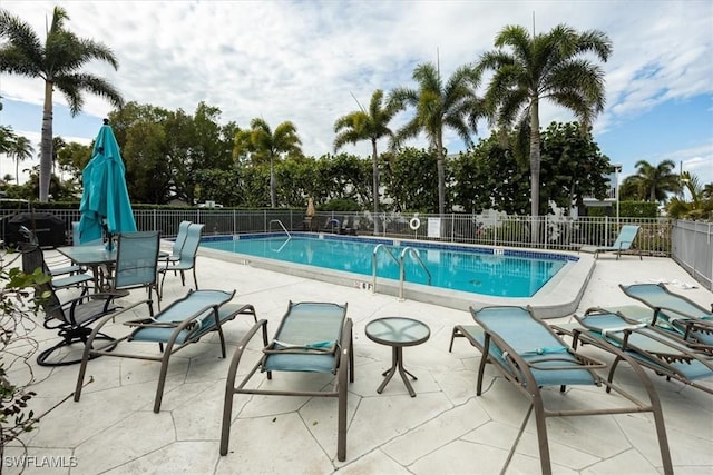 view of swimming pool with a patio area