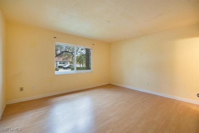 unfurnished room featuring light hardwood / wood-style flooring