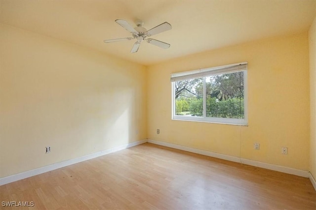 empty room featuring ceiling fan and light hardwood / wood-style floors