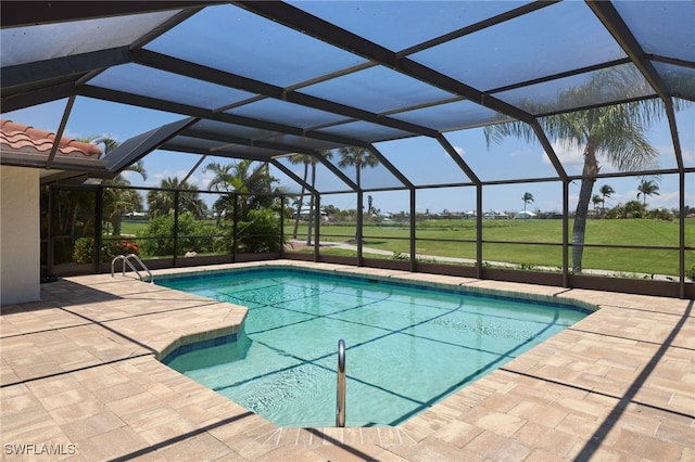 view of swimming pool with a lanai and a patio area