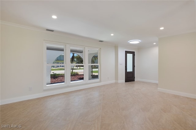 spare room with ornamental molding