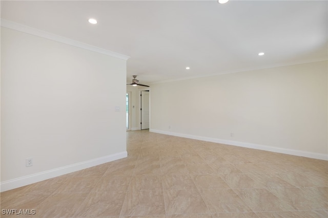 spare room with ceiling fan and crown molding