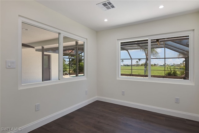 unfurnished room featuring dark hardwood / wood-style floors