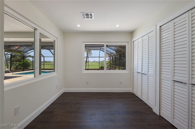 unfurnished bedroom featuring dark hardwood / wood-style floors