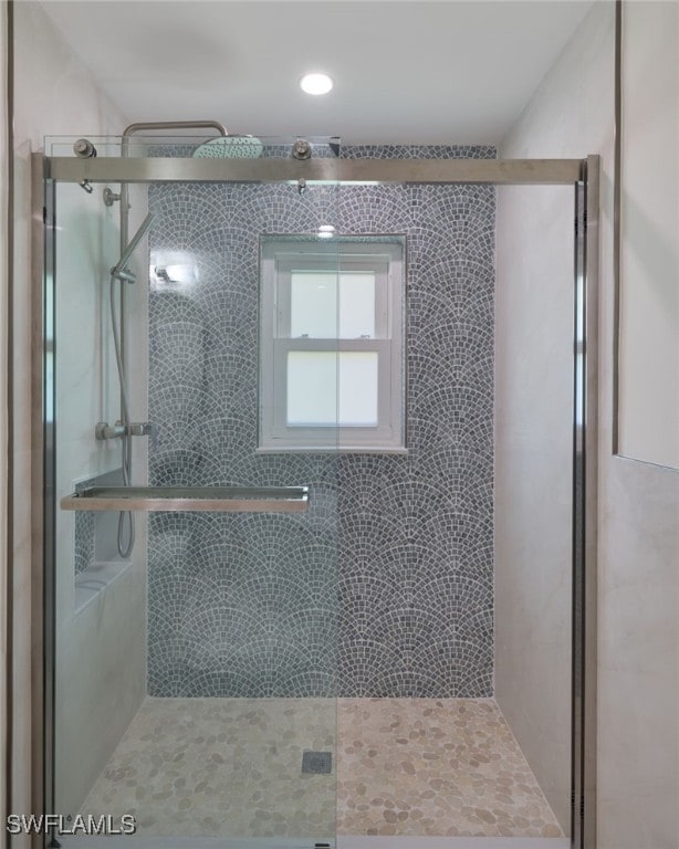 bathroom featuring an enclosed shower